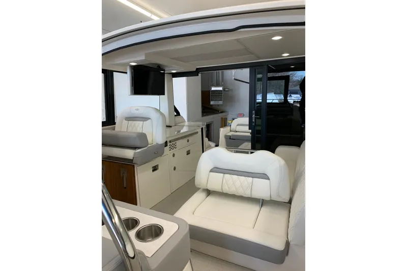 Slide: The Image of 2024 Regal 36 Grande Coupe interior with luxurious seating and modern amenities. - 18
