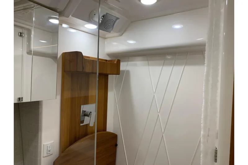 Slide: The Image of Luxurious bathroom interior of 2024 Regal 36 Grande Coupe yacht with modern fixtures. - 26