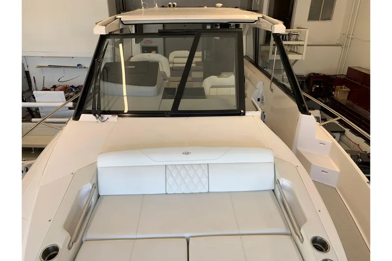 Slide: The Image of 2024 Regal 36 Grande Coupe yacht interior with luxurious seating and modern design. - 28