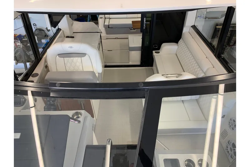 Slide: The Image of 2024 Regal 36 Grande Coupe interior with luxurious white seating and modern design. - 29