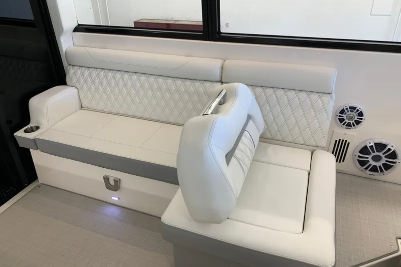 Slide: The Image of Luxurious seating in 2024 Regal 36 Grande Coupe boat interior. - 8
