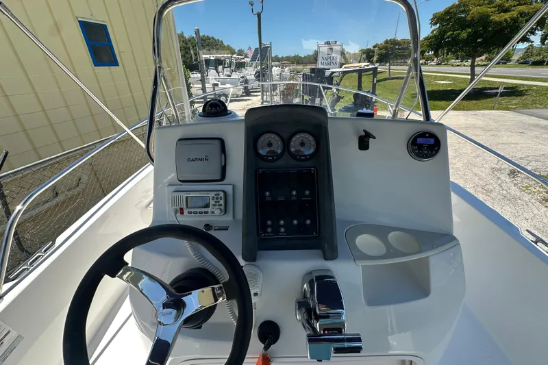Slide: The Image of 2007 Boston Whaler 200 Dauntless boat dashboard with Garmin GPS and steering wheel. - 11