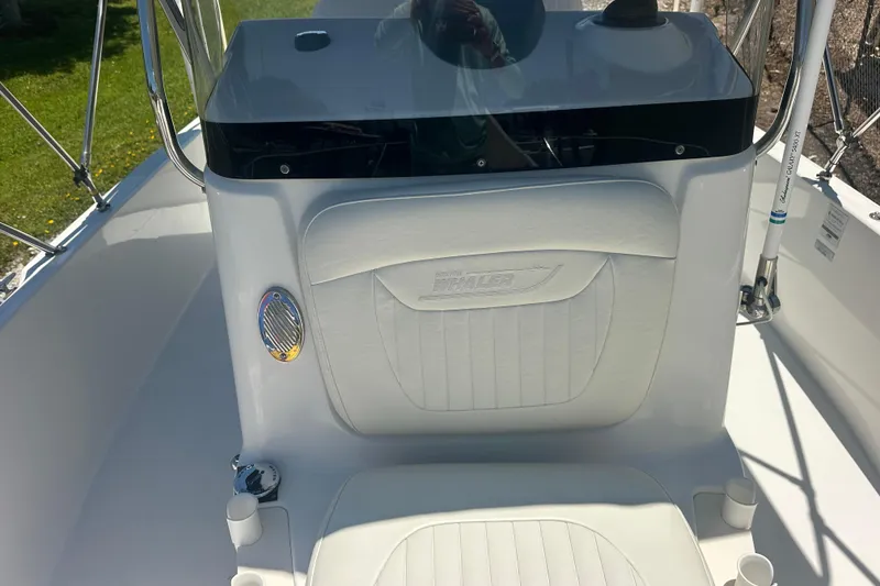Slide: The Image of 2007 Boston Whaler 200 Dauntless boat interior with white seating and console. - 16