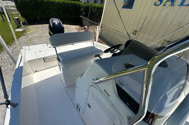 Slide: The Image of 2007 Boston Whaler 200 Dauntless boat interior with seating and steering console. - 18