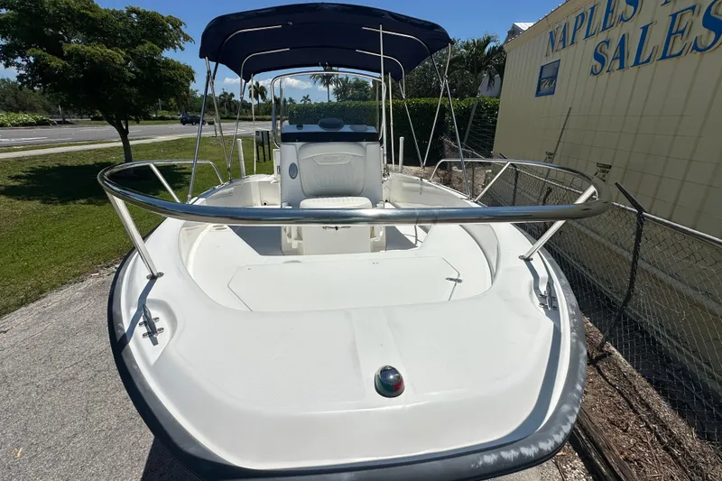 Slide: The Image of 2007 Boston Whaler 200 Dauntless boat with canopy, parked near Naples Yacht Sales. - 3