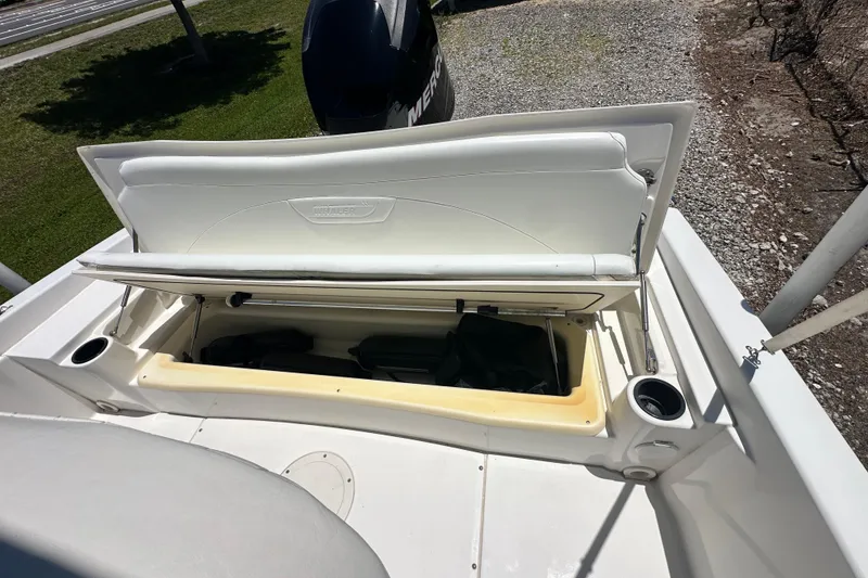 Slide: The Image of 2007 Boston Whaler 200 Dauntless boat storage compartment open, showing interior space. - 9