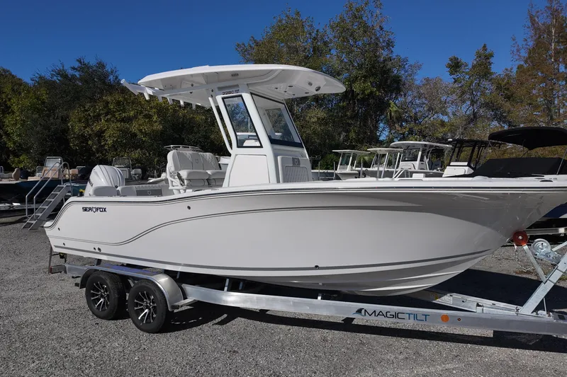 The Image of 2026 Sea Fox 228 Commander boat on trailer, parked outdoors. - 0