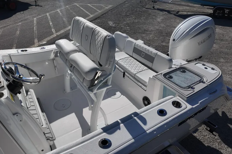 Slide: The Image of 2026 Sea Fox 228 Commander boat interior with Yamaha engine, featuring seating and steering wheel. - 11