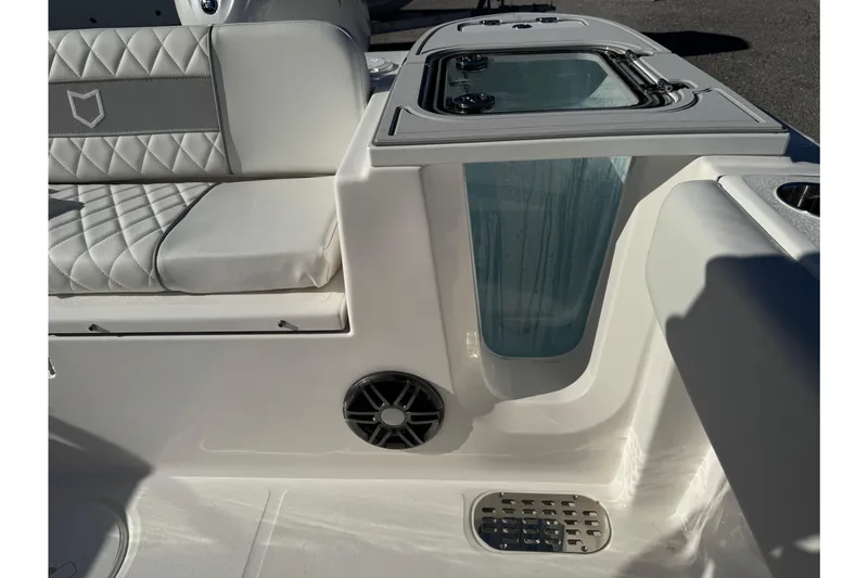 Slide: The Image of Interior view of 2026 Sea Fox 228 Commander boat, featuring seating and storage. - 12