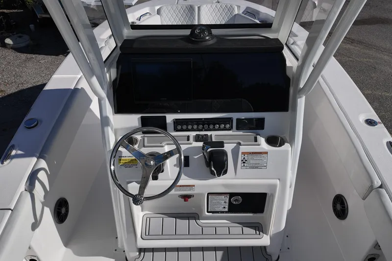 Slide: The Image of 2026 Sea Fox 228 Commander boat console with steering wheel and controls. - 5