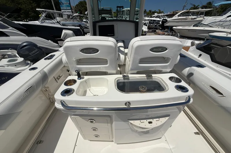 Slide: The Image of 2014 Boston Whaler 250 Outrage boat interior with seating and fishing station. - 11