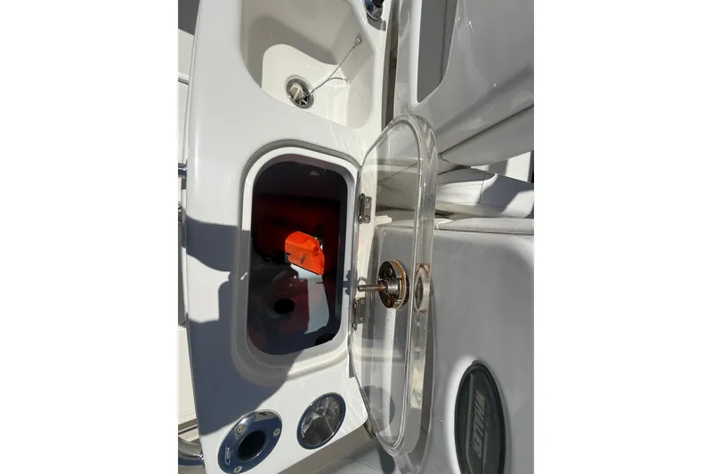Slide: The Image of 2014 Boston Whaler 250 Outrage boat interior with open storage compartment. - 15