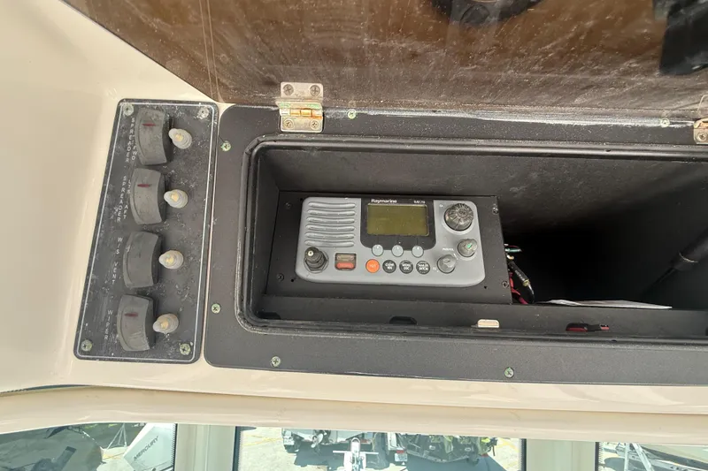 Slide: The Image of 2014 Boston Whaler 250 Outrage radio and control panel detail. - 28