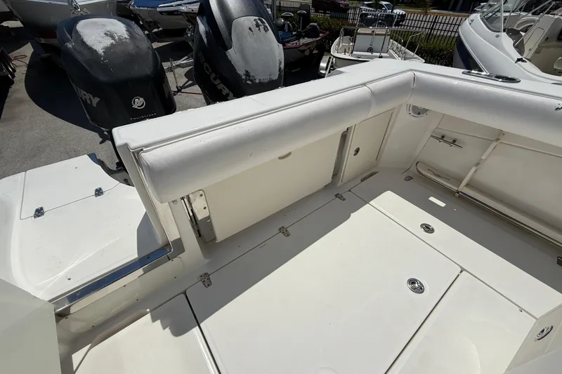 Slide: The Image of 2014 Boston Whaler 250 Outrage boat interior with seating and Mercury outboard engines. - 6