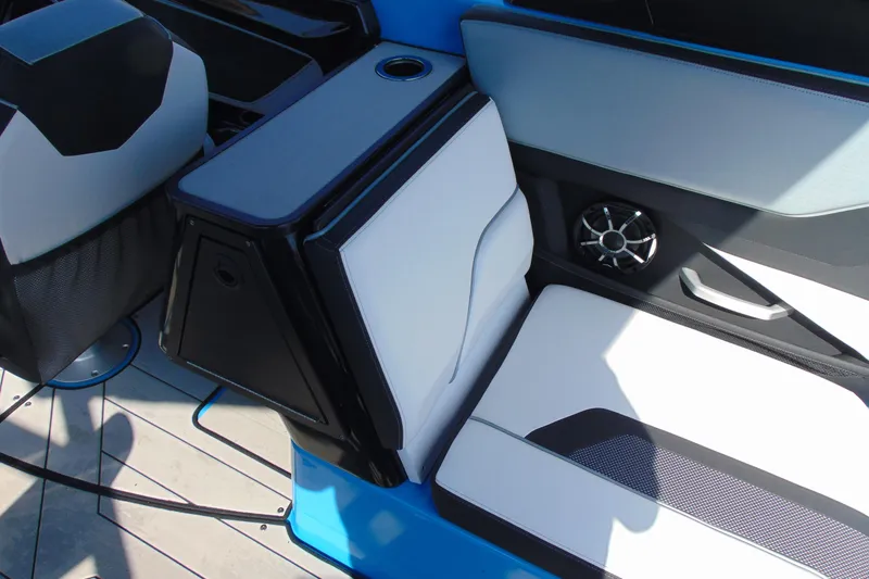 Slide: The Image of 2022 Yamaha Boats 255XD interior seating with speaker and cup holder. - 13