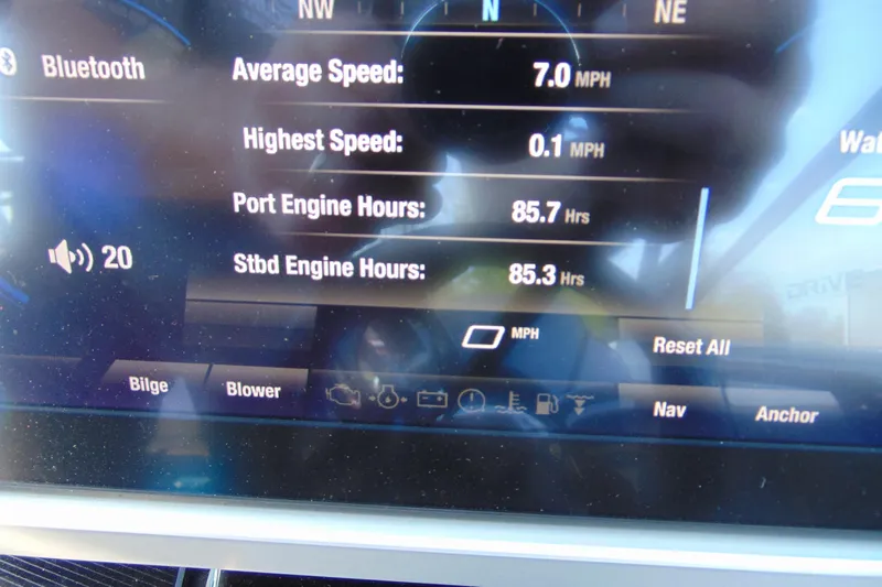 Slide: The Image of Dashboard display of a 2022 Yamaha Boats 255XD showing engine hours and speed metrics. - 16