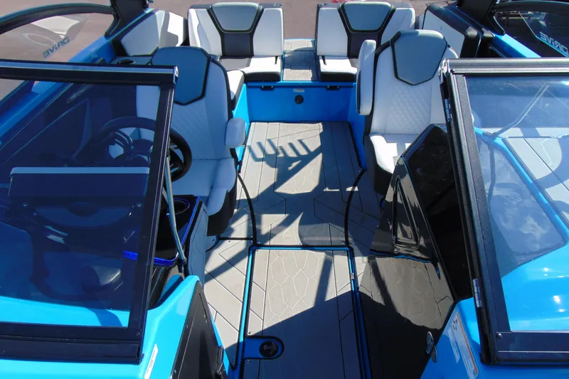 Slide: The Image of Interior view of 2022 Yamaha Boats 255XD, featuring sleek seating and modern design. - 19