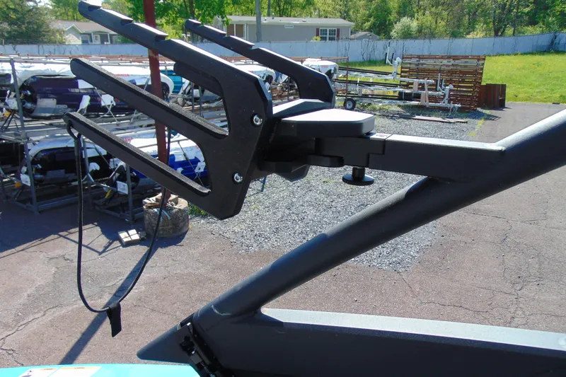 Slide: The Image of Wakeboard rack on a 2022 Yamaha Boats 255XD, parked outdoors. - 20