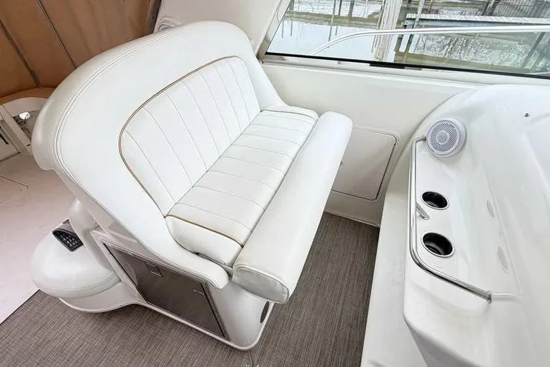 Slide: The Image of White leather seating on 1998 Sea Ray 370 Express Cruiser boat interior. - 17