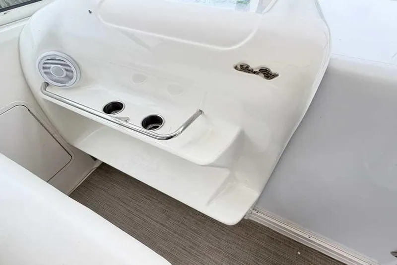 Slide: The Image of 1998 Sea Ray 370 Express Cruiser interior with cup holders and speaker. - 18