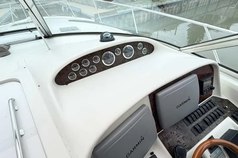 Slide: The Image of 1998 Sea Ray 370 Express Cruiser helm with Garmin navigation system and instrument panel. - 20
