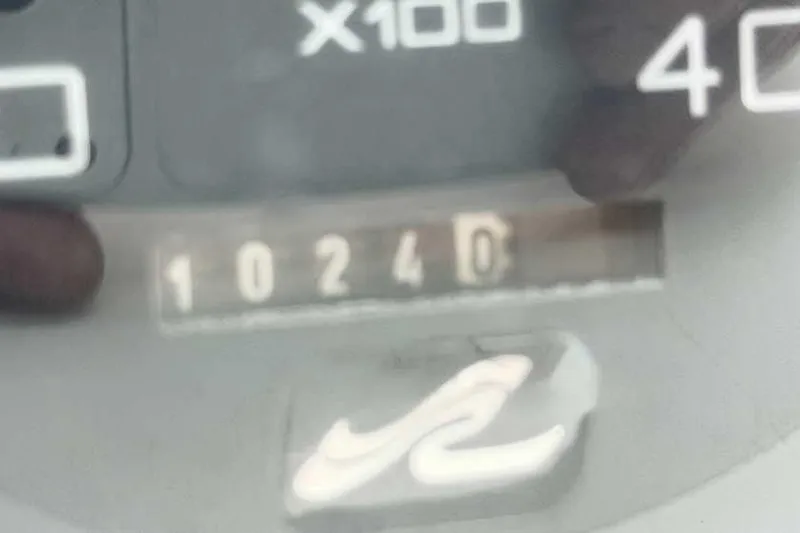 Slide: The Image of Close-up of a 1998 Sea Ray 370 Express Cruiser odometer reading 10240. - 21