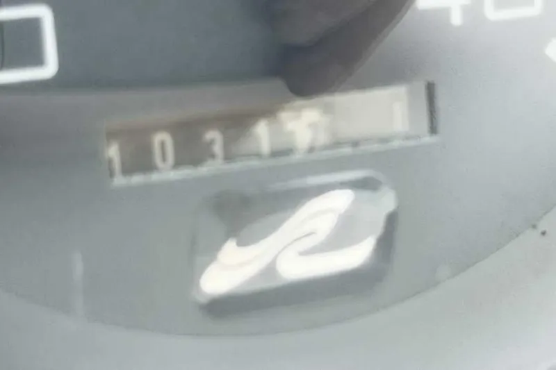 Slide: The Image of Close-up of a 1998 Sea Ray 370 Express Cruiser's odometer reading 10317 hours. - 22