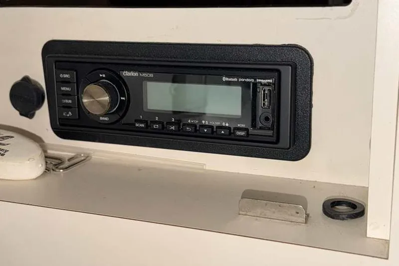 Slide: The Image of Clarion stereo system in 1998 Sea Ray 370 Express Cruiser dashboard. - 35