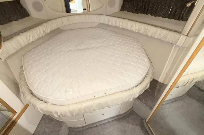 Slide: The Image of Interior cabin of 1998 Sea Ray 370 Express Cruiser with a comfortable bed. - 39