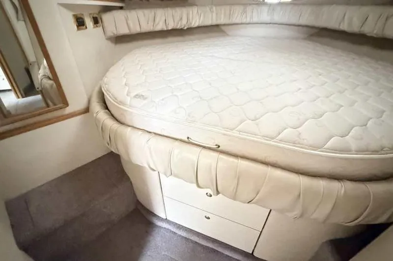 Slide: The Image of Interior cabin of 1998 Sea Ray 370 Express Cruiser with a cozy bed. - 41