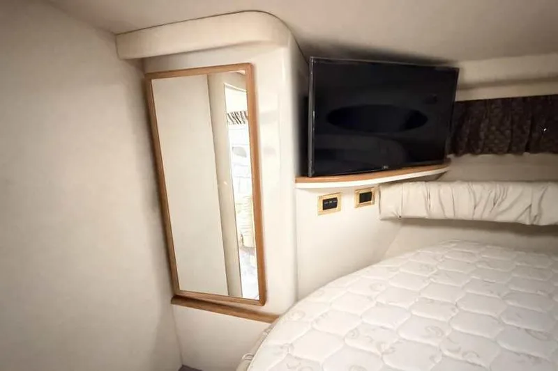 Slide: The Image of Interior of 1998 Sea Ray 370 Express Cruiser with TV and mirror. - 42