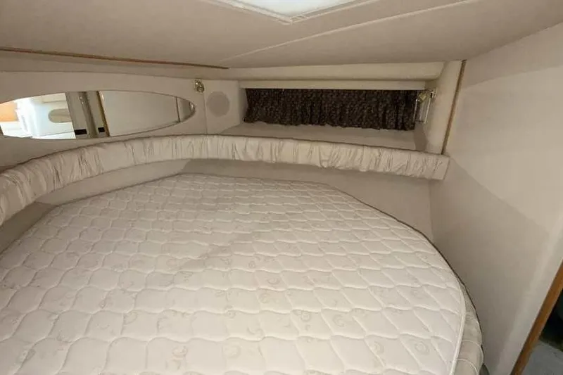 Slide: The Image of Interior cabin of 1998 Sea Ray 370 Express Cruiser with a comfortable bed. - 45