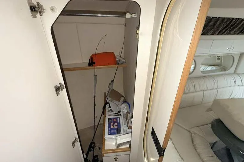 Slide: The Image of Interior storage of 1998 Sea Ray 370 Express Cruiser with fishing gear and supplies. - 47