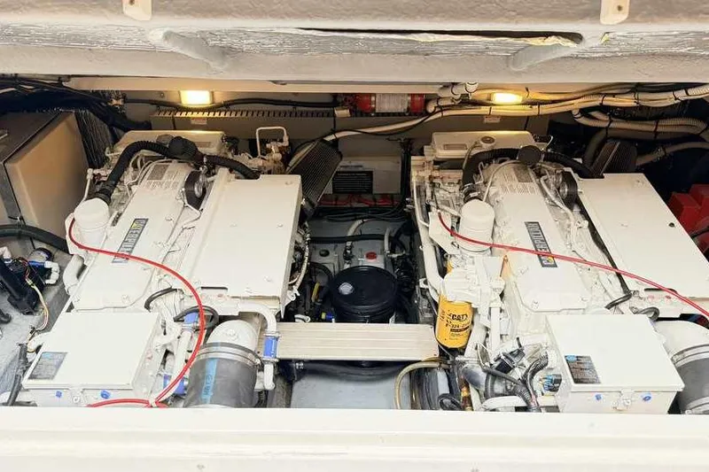 Slide: The Image of Engine room of a 1998 Sea Ray 370 Express Cruiser with twin engines. - 49