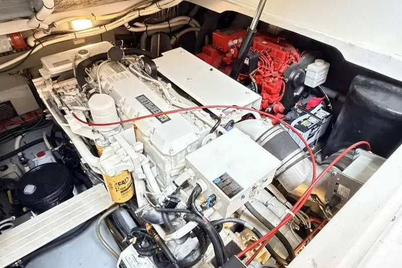 Slide: The Image of Engine compartment of a 1998 Sea Ray 370 Express Cruiser, showcasing mechanical components. - 50