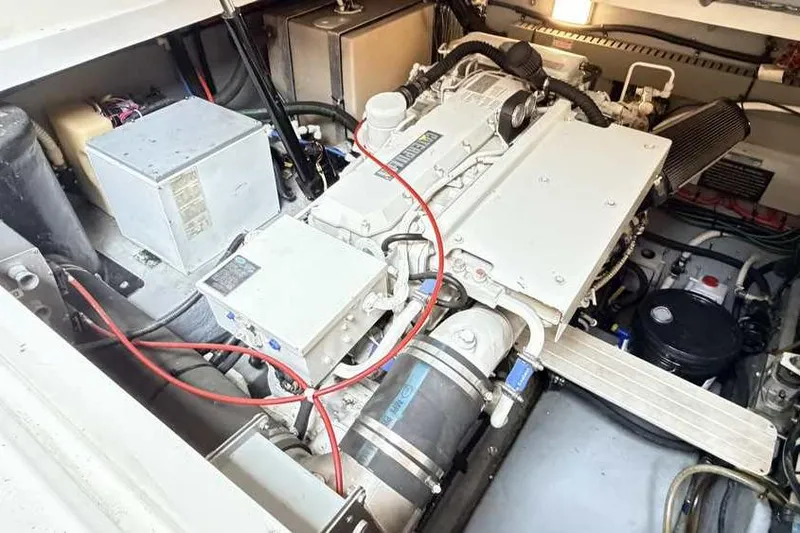 Slide: The Image of Engine room of a 1998 Sea Ray 370 Express Cruiser, showcasing mechanical components. - 51