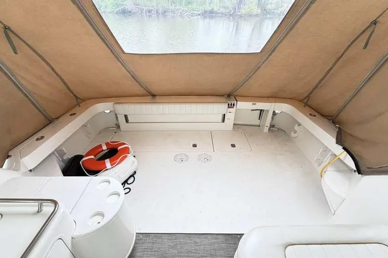 Slide: The Image of 1998 Sea Ray 370 Express Cruiser interior with canopy and life preserver. - 8