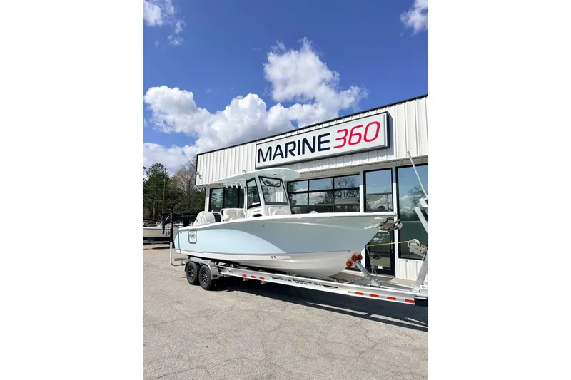 The Image of 2026 Sea Hunt Ultra 255 SE boat on trailer at Marine 360 dealership. - 1