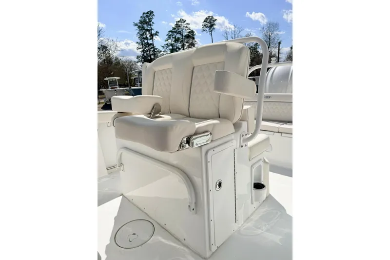 Slide: The Image of Luxury seating on 2026 Sea Hunt Ultra 255 SE boat, featuring plush white upholstery. - 11