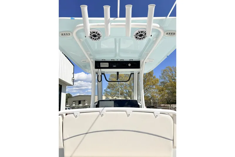 Slide: The Image of 2026 Sea Hunt Ultra 255 SE boat interior with rod holders and speakers. - 12