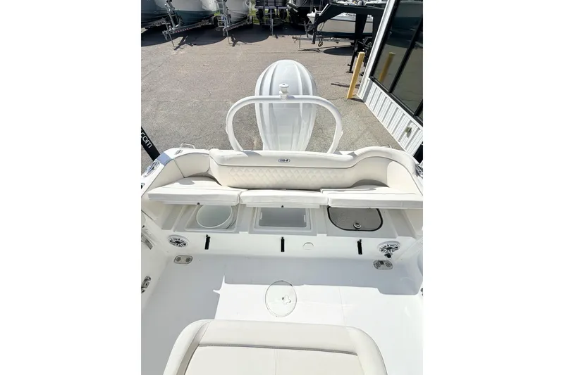 Slide: The Image of 2026 Sea Hunt Ultra 255 SE boat interior with seating and storage compartments. - 14
