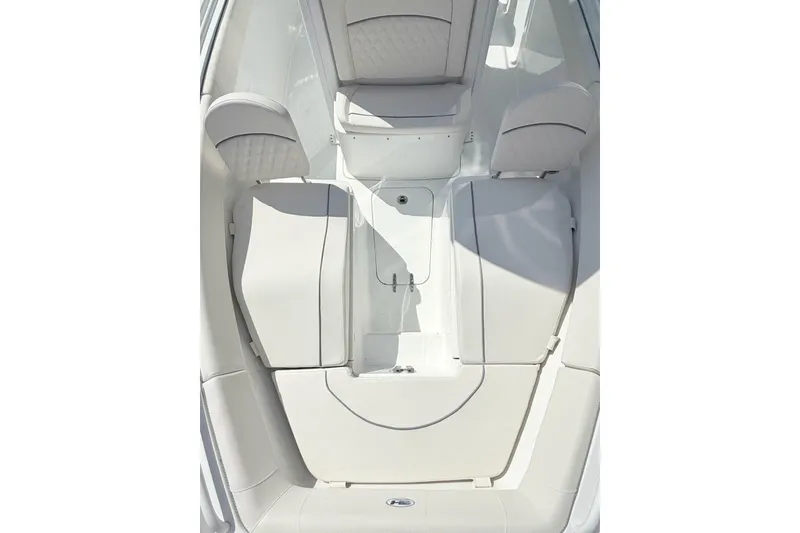 Slide: The Image of 2026 Sea Hunt Ultra 255 SE boat interior with cushioned seating and storage compartments. - 20