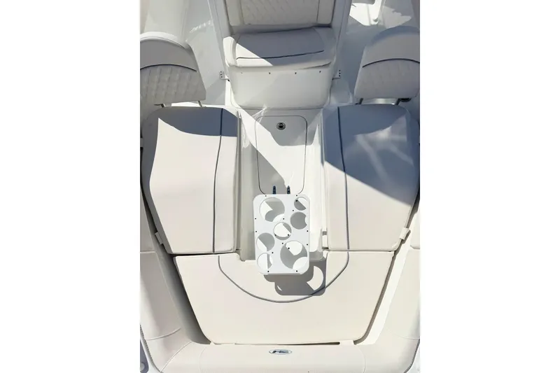 Slide: The Image of 2026 Sea Hunt Ultra 255 SE boat interior with seating and cup holders. - 24