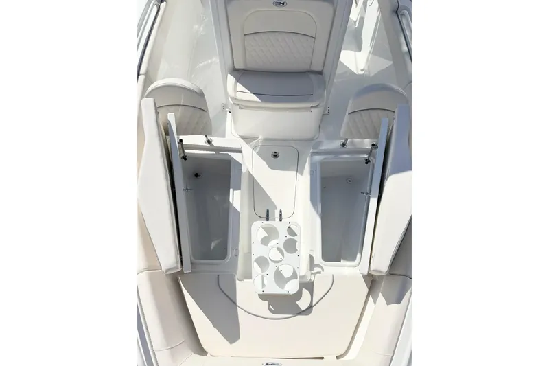 Slide: The Image of 2026 Sea Hunt Ultra 255 SE boat interior with open storage compartments and seating. - 26