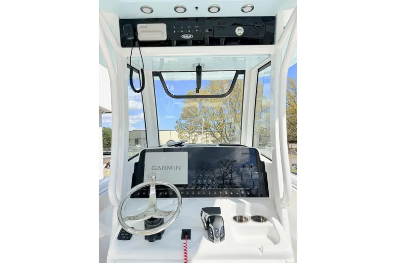 Slide: The Image of 2026 Sea Hunt Ultra 255 SE boat dashboard with Garmin navigation system. - 7