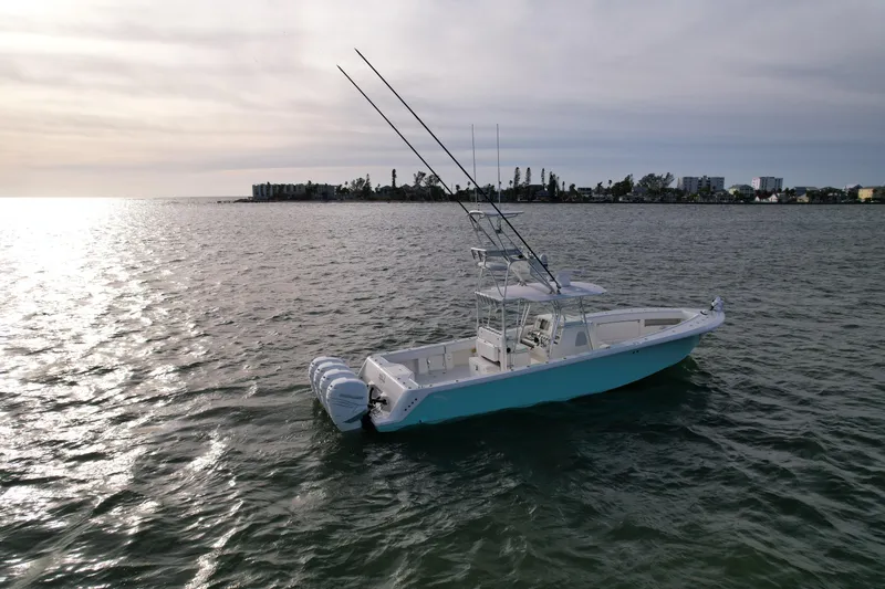Slide: The Image of 2013 SeaVee 390B boat on calm waters at sunset. - 4