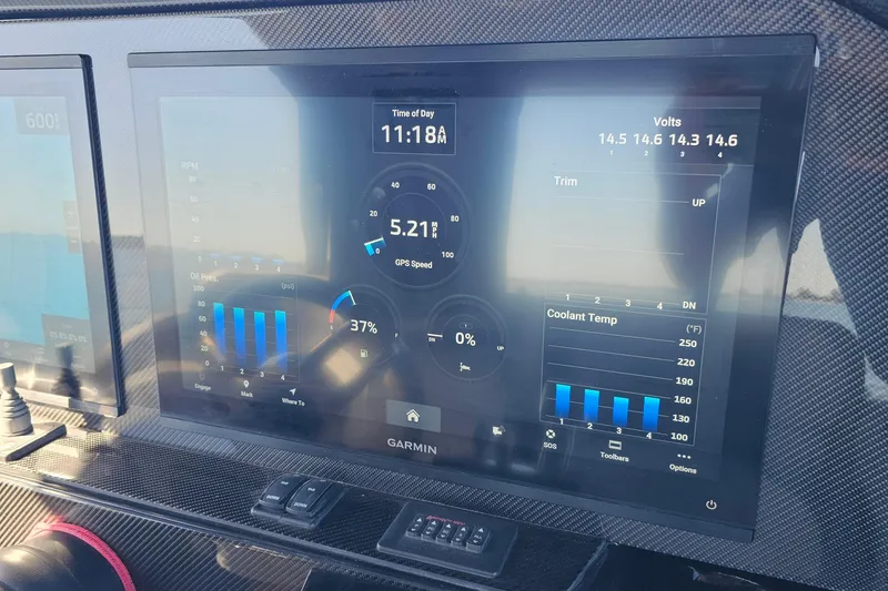 Slide: The Image of Dashboard of 2025 Nor-Tech 390 Sport Center Console with Garmin display showing GPS speed and engine data. - 29