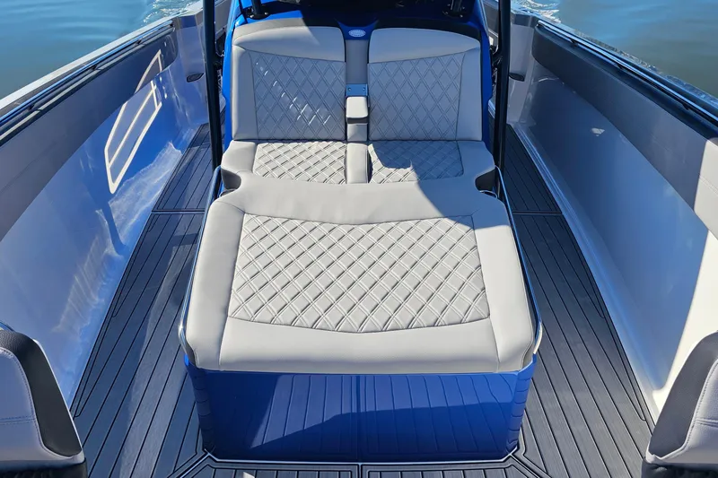 Slide: The Image of 2025 Nor-Tech 390 Sport Center Console with luxurious quilted seating and sleek design. - 35