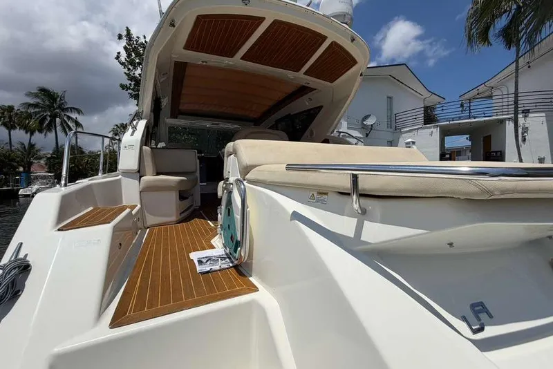 The Image of Cranchi M44 HT yacht cruising near city skyline and Ferris wheel, 2013 model. - 0