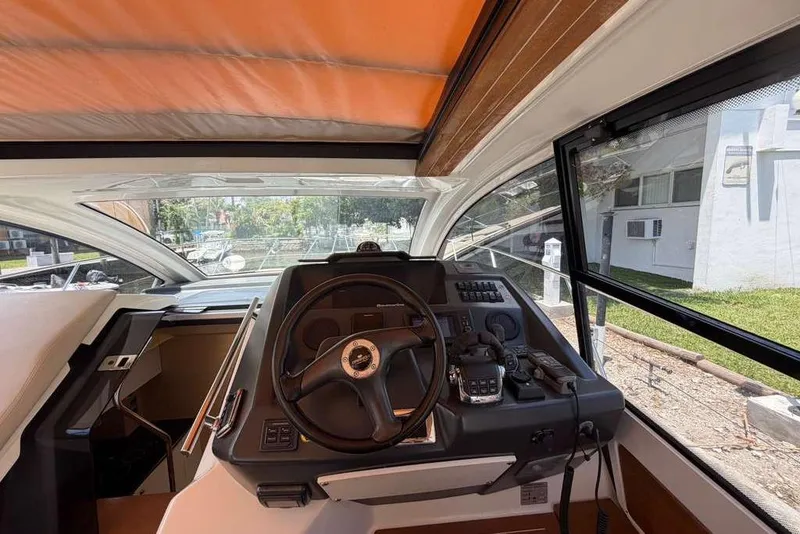 Slide: The Image of Interior of 2013 Cranchi Endurance 41 yacht featuring a modern kitchenette. - 11